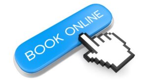 An online booking button with a hand pushing the button for 24/7 appointment scheduling