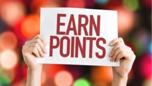 Hands holding up a sign for a salon loyalty program