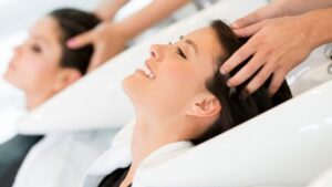 Clients in a hairdressers enjoying the benefits of a salon loyalty program